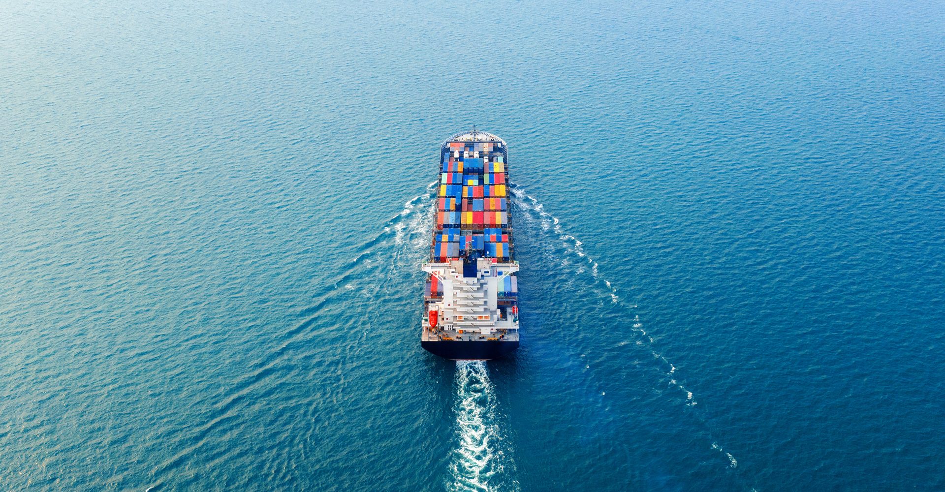 Aerial view of container cargo ship in sea. Aerial view of container cargo ship in sea.